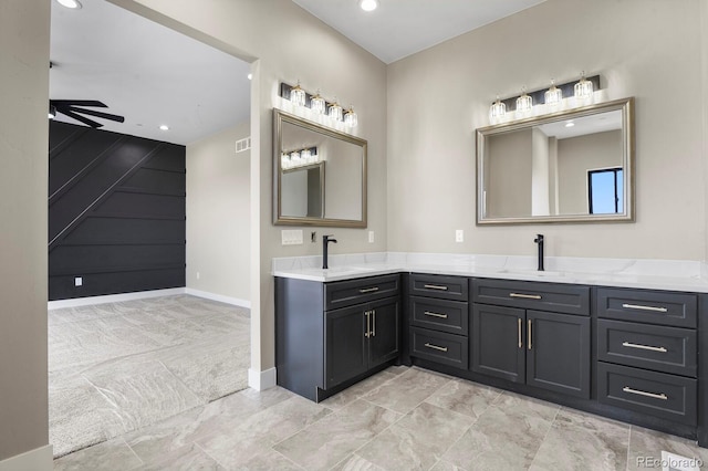 16250 Kenosha St, Brighton, CO 80603 - full bathroom with a sink, baseboards, double vanity, and a ceiling fan