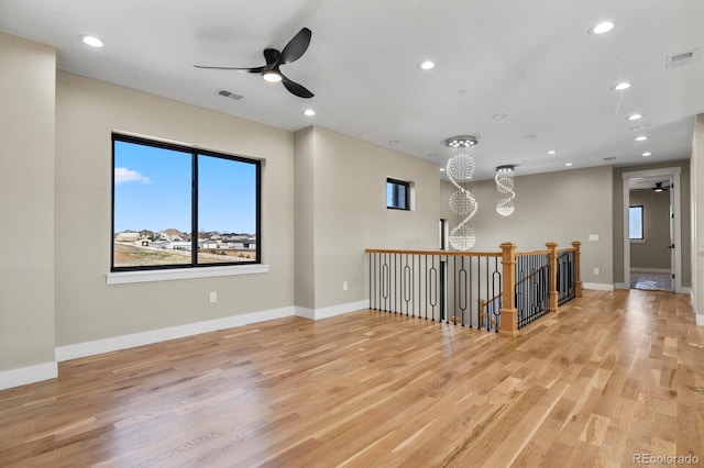 16250 Kenosha St, Brighton, CO 80603 - spare room with visible vents, light wood-type flooring, and baseboards