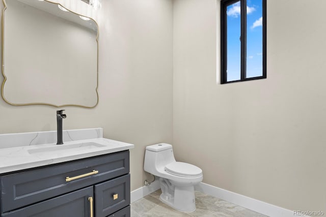 16250 Kenosha St, Brighton, CO 80603 - half bath featuring baseboards, toilet, and vanity