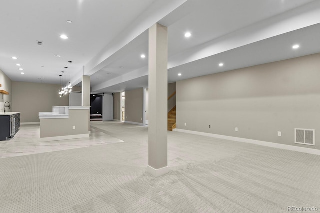 16250 Kenosha St, Brighton, CO 80603 - below grade area with visible vents, recessed lighting, a barn door, light colored carpet, and stairs