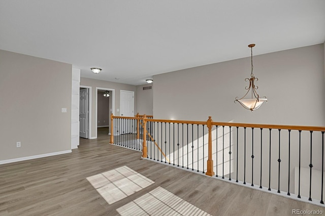 empty room featuring ceiling fan and hardwood / wood-style floors