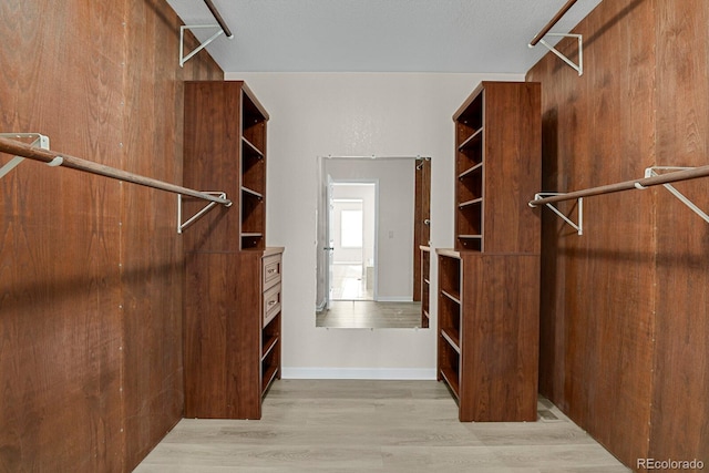 spacious closet featuring light wood-type flooring