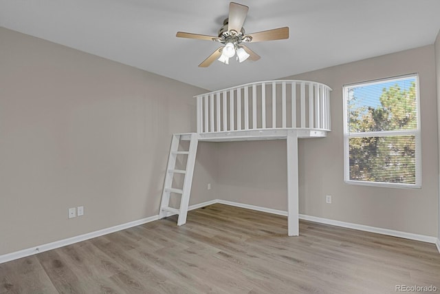 unfurnished bedroom featuring ceiling fan and light wood-type flooring