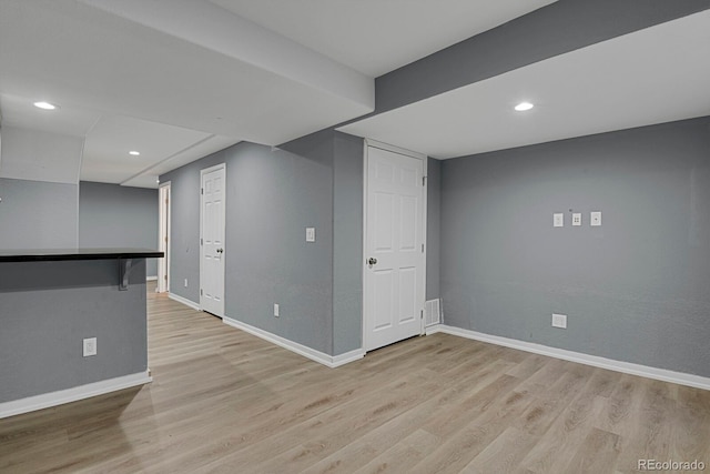 basement with light wood-type flooring