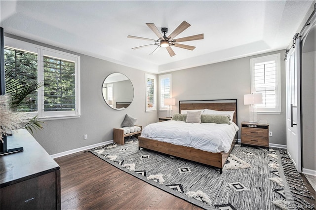 8548 Winter Berry Dr, Castle Pines, CO 80108 - bedroom featuring multiple windows, wood finished floors, and baseboards