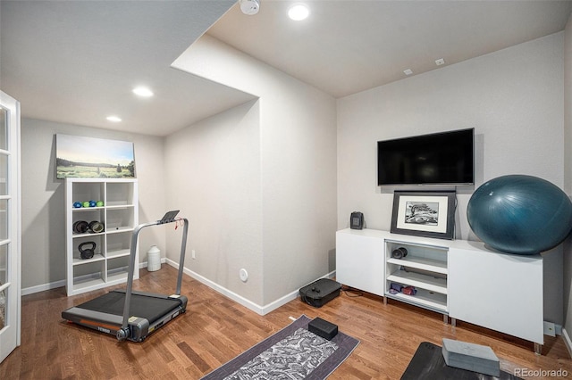 8548 Winter Berry Dr, Castle Pines, CO 80108 - exercise area featuring wood finished floors, baseboards, and recessed lighting