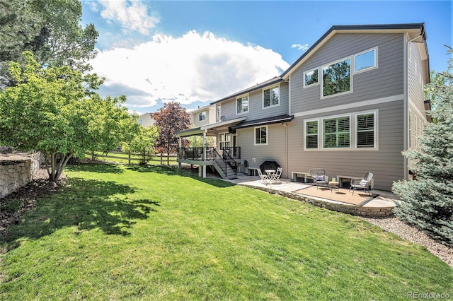 8548 Winter Berry Dr, Castle Pines, CO 80108 - back of property with a patio, a lawn, and stairway