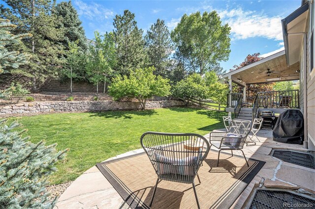 8548 Winter Berry Dr, Castle Pines, CO 80108 - view of patio / terrace with ceiling fan, a deck, and an outdoor hangout area
