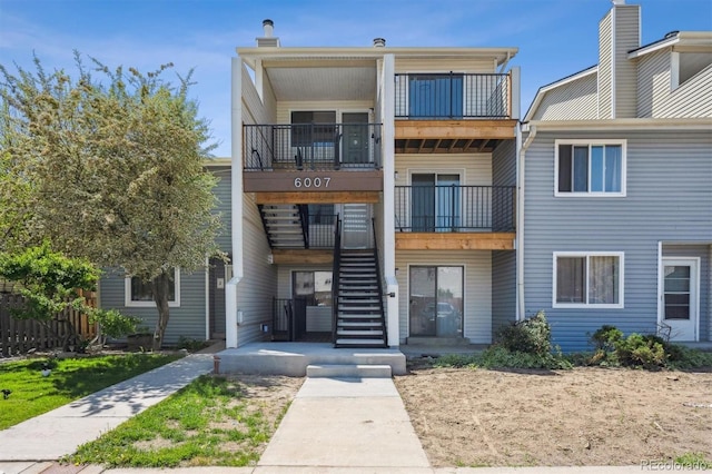 6007 Yarrow St Unit I, Arvada, CO 80004 - view of property featuring stairs and fence