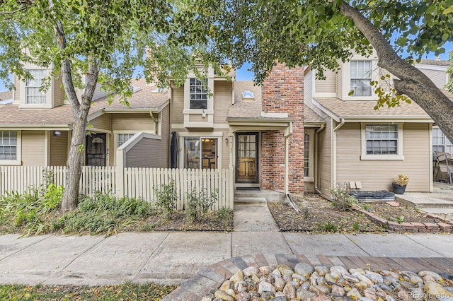 14193 E Radcliff Cir, Aurora, CO 80015 - view of front of house with a shingled roof and a chimney