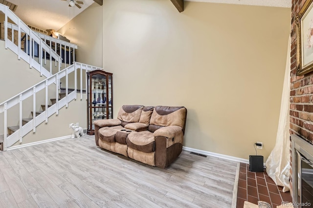 14193 E Radcliff Cir, Aurora, CO 80015 - sitting room with wood finished floors, a ceiling fan, stairway, and baseboards