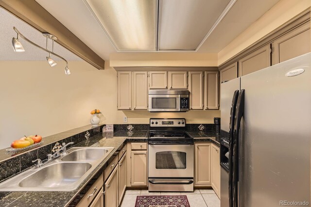 14193 E Radcliff Cir, Aurora, CO 80015 - kitchen featuring appliances with stainless steel finishes, a sink, and light tile patterned floors