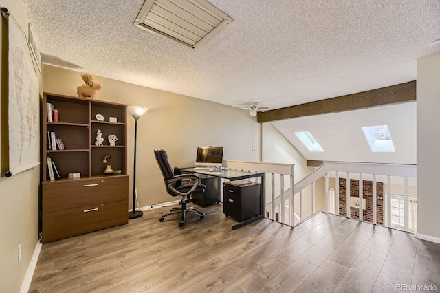 14193 E Radcliff Cir, Aurora, CO 80015 - office area featuring a skylight, wood finished floors, a textured ceiling, and baseboards