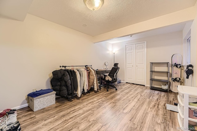 14193 E Radcliff Cir, Aurora, CO 80015 - office featuring wood finished floors, a textured ceiling, and baseboards