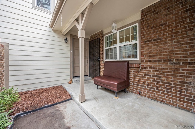 entrance to property with brick siding