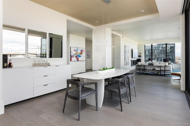 dining area with light hardwood / wood-style floors