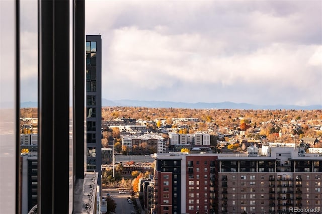 property's view of city with a mountain view