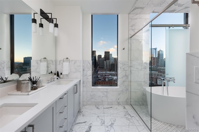 bathroom with vanity and a bath