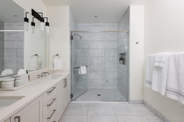 bathroom featuring vanity and an enclosed shower