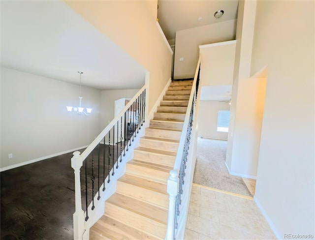 7958 Lightwood Way, Colorado Springs, CO 80908 - staircase with a chandelier and baseboards