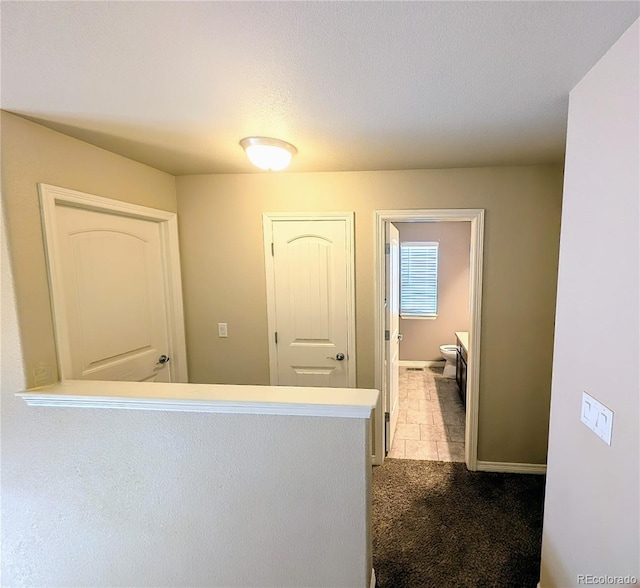 7958 Lightwood Way, Colorado Springs, CO 80908 - corridor featuring carpet floors