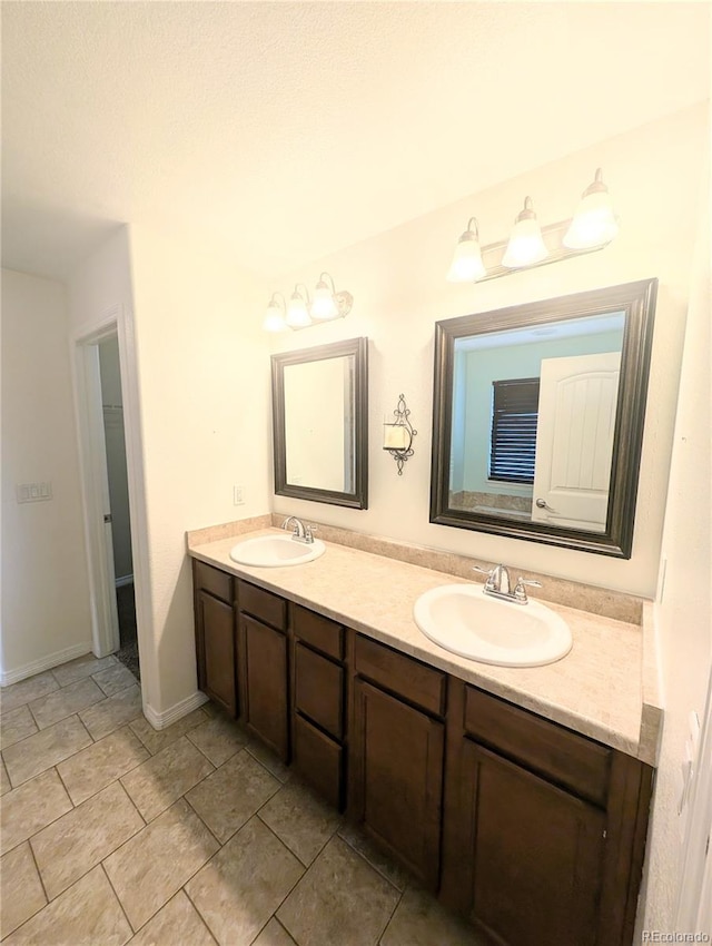 7958 Lightwood Way, Colorado Springs, CO 80908 - full bathroom with double vanity and baseboards