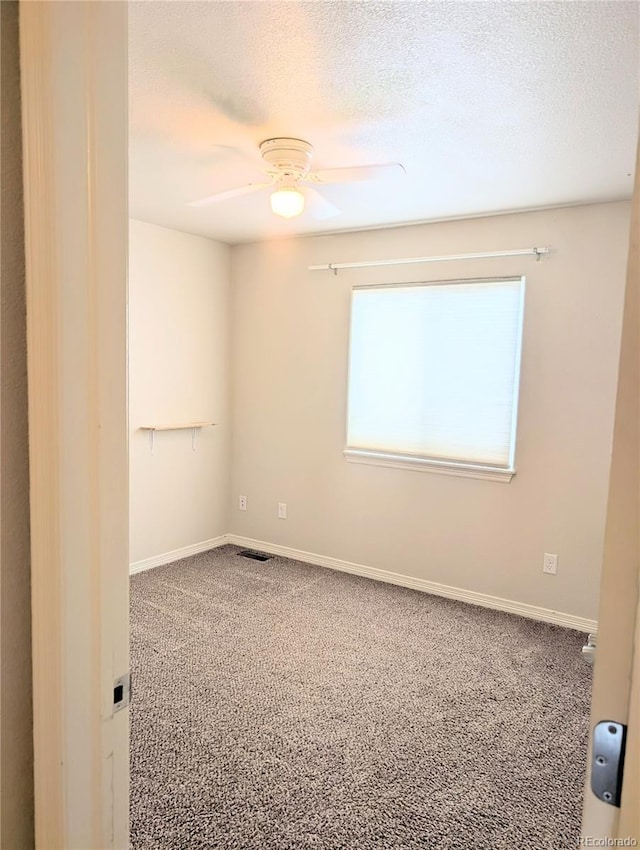 7958 Lightwood Way, Colorado Springs, CO 80908 - empty room featuring a ceiling fan, carpet flooring, a textured ceiling, and baseboards