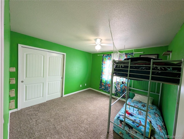 7958 Lightwood Way, Colorado Springs, CO 80908 - unfurnished bedroom featuring carpet floors, a textured ceiling, a closet, and ceiling fan