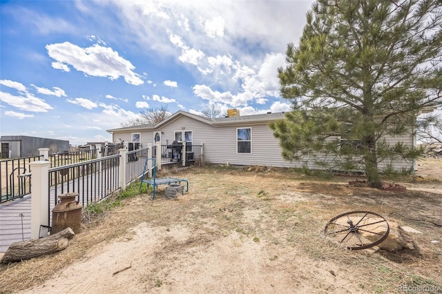 7080 S Calhan Rd, Calhan, CO 80808 - rear view of house featuring fence
