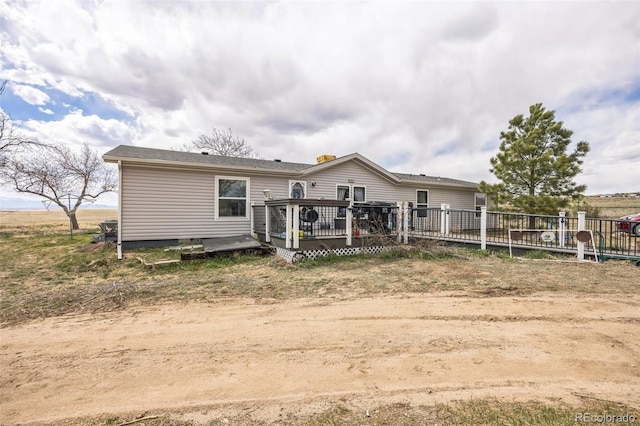 7080 S Calhan Rd, Calhan, CO 80808 - rear view of house with a wooden deck