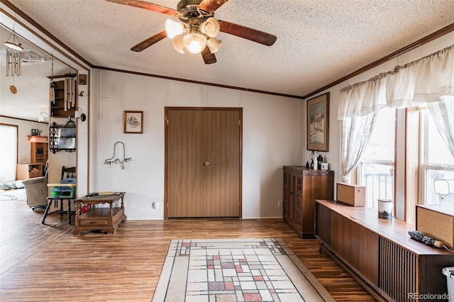 7080 S Calhan Rd, Calhan, CO 80808 - interior space featuring ornamental molding, a textured ceiling, and wood finished floors