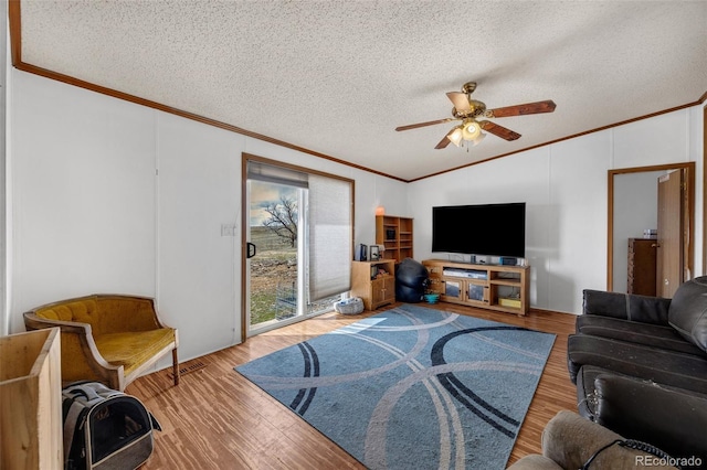 7080 S Calhan Rd, Calhan, CO 80808 - living room featuring crown molding, a textured ceiling, lofted ceiling, and ceiling fan