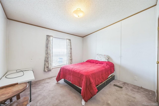 7080 S Calhan Rd, Calhan, CO 80808 - bedroom with crown molding, a textured ceiling, visible vents, and carpet floors