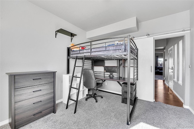 carpeted bedroom with baseboards