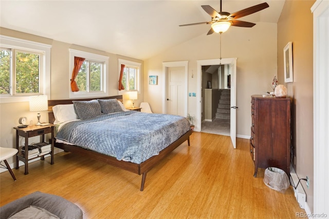 147 Moonlight Way, Crestone, CO 81131 - bedroom with light wood-type flooring, vaulted ceiling, baseboards, and ceiling fan
