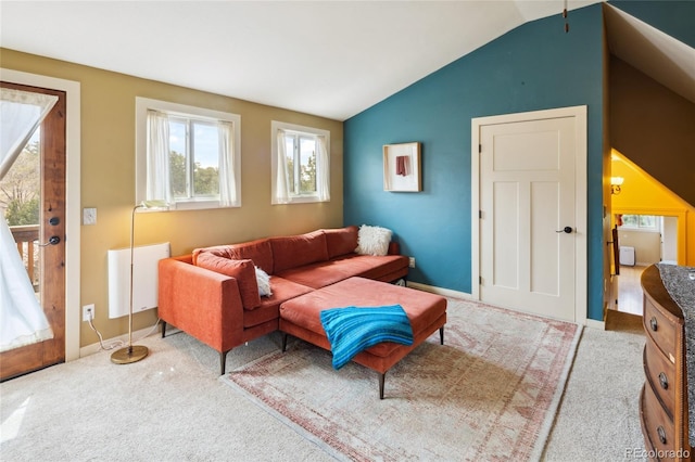 147 Moonlight Way, Crestone, CO 81131 - carpeted living room with lofted ceiling, baseboards, and radiator
