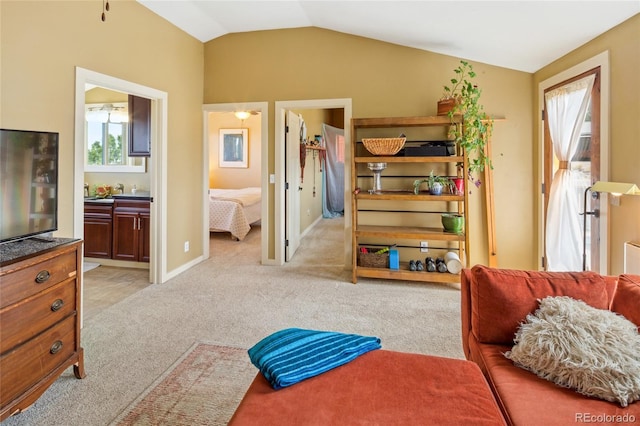 147 Moonlight Way, Crestone, CO 81131 - sitting room featuring light carpet and vaulted ceiling