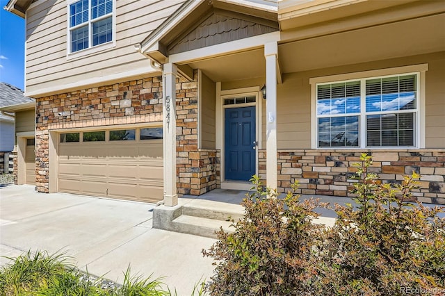5841 Echo Park Cir, Castle Rock, CO 80104 - view of exterior entry with stone siding and driveway