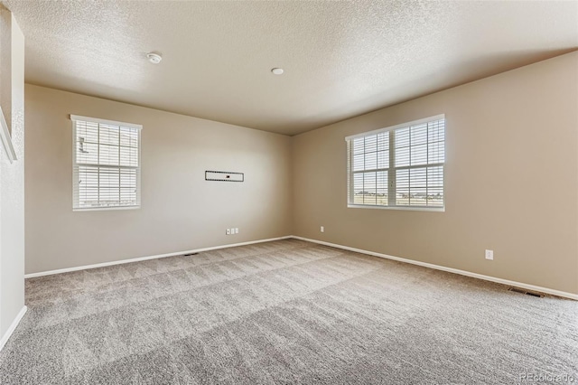 5841 Echo Park Cir, Castle Rock, CO 80104 - carpeted spare room featuring a textured ceiling and a smoke detector