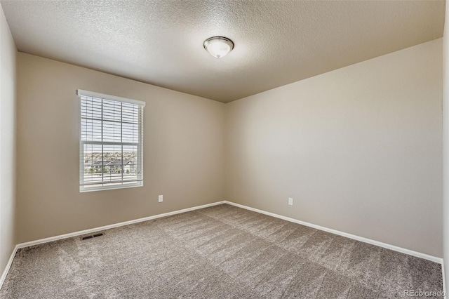 5841 Echo Park Cir, Castle Rock, CO 80104 - carpeted spare room with baseboards and a textured ceiling