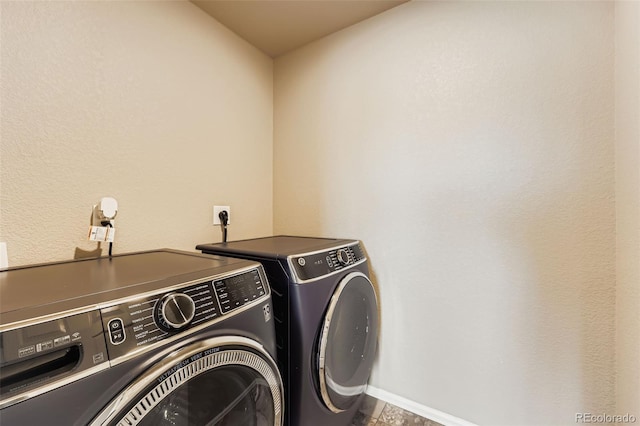 5841 Echo Park Cir, Castle Rock, CO 80104 - laundry room with washer and dryer and baseboards