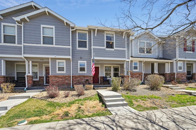 view of front of property with brick siding and a porch