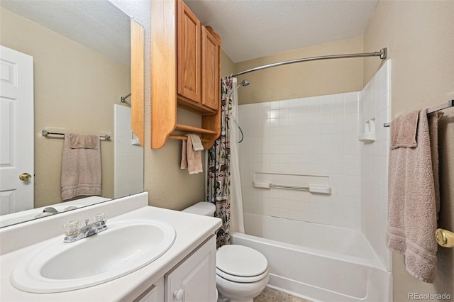 bathroom with shower / bath combo, vanity, a textured ceiling, and toilet