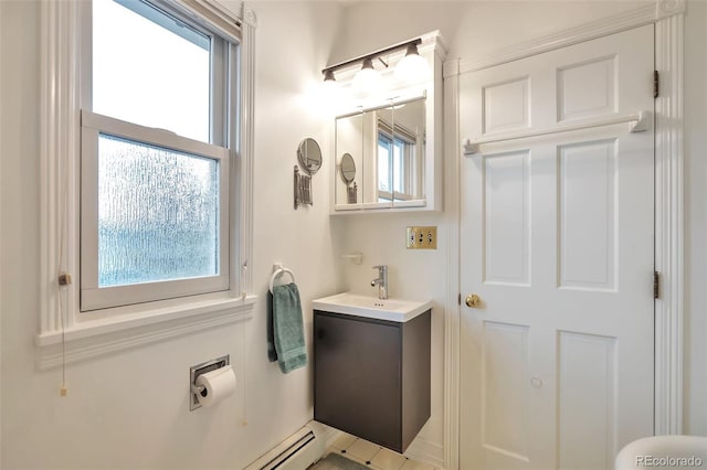 half bathroom with plenty of natural light and vanity