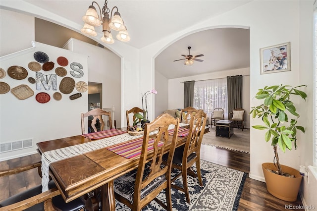 412 Iron St, Brighton, CO 80603 - dining area featuring arched walkways, dark wood-style floors, a chandelier, and a ceiling fan