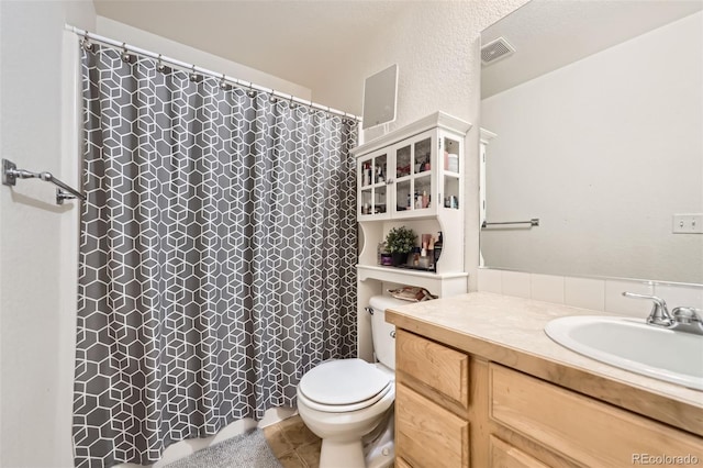 412 Iron St, Brighton, CO 80603 - bathroom with vanity, a shower with shower curtain, and tile patterned floors