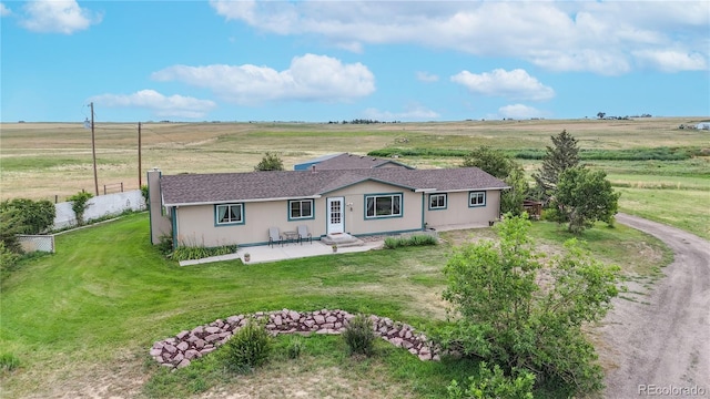 4160 Converse Rd, Bennett, CO 80102 - ranch-style house featuring a patio area and a view of countryside