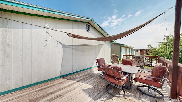 4160 Converse Rd, Bennett, CO 80102 - wooden deck featuring outdoor dining space