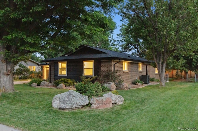 8612 W 69th Pl, Arvada, CO 80004 - view of front of house featuring a lawn and brick siding