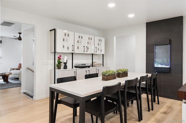 8612 W 69th Pl, Arvada, CO 80004 - dining space featuring light wood-type flooring, a ceiling fan, and recessed lighting